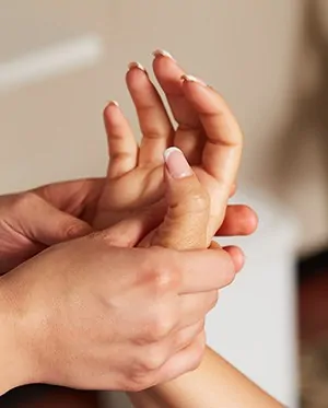 Close-up of hands receiving massage
